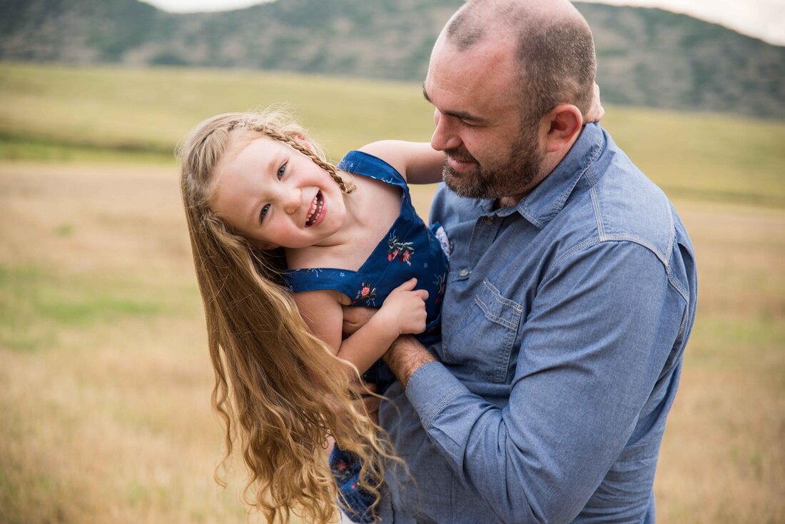 candid family photos - littleton family photographers - father daughter